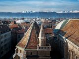 Aerial view of Geneva and St Pierre Cathedral with Alps Mountains - Geneva, Switzerland