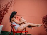 Candid caucasian black hair young adult lady in swimsuit spending summer vacation in the open air