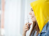 Stop smoking, woman cuts a cigarette with scissors